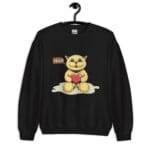 A cute unisex sweatshirt featuring a happy cartoon cat holding a red heart, sitting on a soft surface with a speech bubble saying "HELLO."