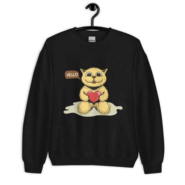 A cute unisex sweatshirt featuring a happy cartoon cat holding a red heart, sitting on a soft surface with a speech bubble saying "HELLO."