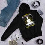 Cozy unisex hoodie with a stylish "Peace, Love & A Touch of Realness" design.