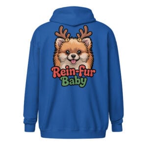 Cheerful Pomeranian puppy wearing reindeer antlers with Rein-fur Baby text on a zip hoodie for dog moms and dads