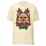 Cheerful Pomeranian puppy wearing reindeer antlers and jingle bells on a Rein-fur Baby t-shirt for dog moms and dads