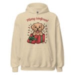 Cheerful Golden Retriever puppy popping out of a Christmas gift box with Merry Woofmas text on a unisex hoodie gift for dog moms and dads